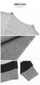 Detailed macro view of grey striped knit sweater texture with ribbed cuffs and hem.