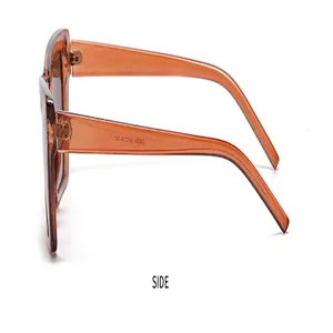 Seitenansicht der trendigen orangefarbenen Katzenaugen-Sonnenbrille mit transparentem Rahmen.