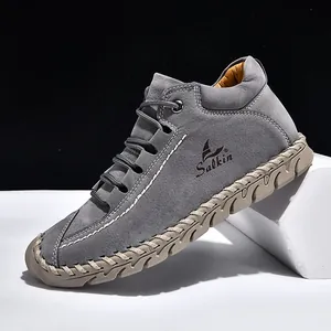 Stylish grey handmade stitched loafers with flat soles, suede finish, and modern design