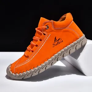 Vibrant orange hand-stitched leather loafers with durable rubber sole for outdoor casual wear.