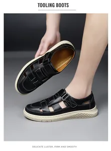 Close-up of black breathable leather sandals for men featuring a hollow-out tooling design
