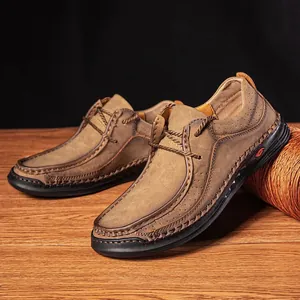 Detail showing hand-stitched seams and breathable nubuck leather on brown men's loafers