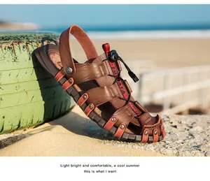 Detailed side view of breathable brown leather men's sandals on a sunny beach setting