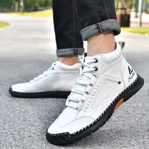 Detailed side view of white leather boots featuring hand-stitched soles and lace-up design