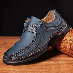 Close-up view of blue leather men's loafers with hand-stitched seams and textures