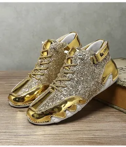 Detailed side view of metallic gold sequined high top Martin boots on wooden surface
