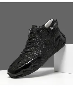 Close-up of black glitter high-top boots with octopus-style sole and ankle strap