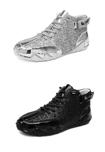 Detailed view showing silver and black high-top glitter martin boots with octopus lug soles