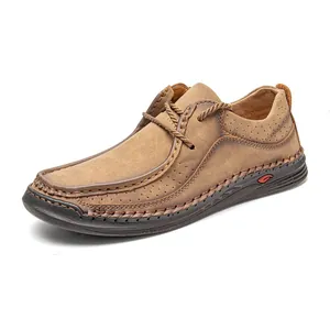 Detailed side view of classic tan leather men's driving loafers with hand-stitched accents.