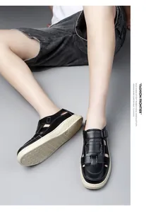 Detail view of men's black handmade breathable leather sandals with thick rubber soles