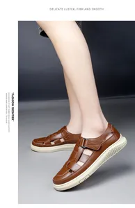Brown leather breathable sandals with stylish cutouts and rubber soles shown on model