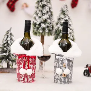 Festive Christmas reindeer knitted wine bottle covers with white faux fur collar decor