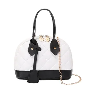 Elegant black and white quilted shell handbag with gold chain strap for women.