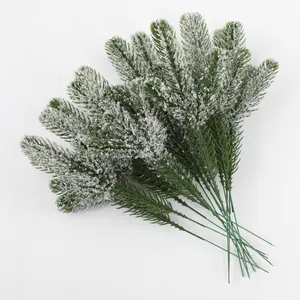 Macro view of three-prong frosted artificial pine needles for Christmas DIY floral decor