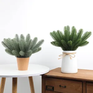 Detailed shot of two realistic potted artificial PE pine needles for home decor
