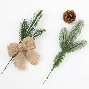 Artificial frosted pine needle branches with burlap bow and natural pine cone