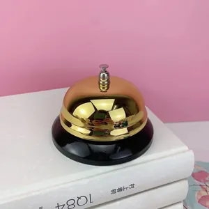 Timbre de servicio clásico de metal dorado pulido con base negra estable para mostrador