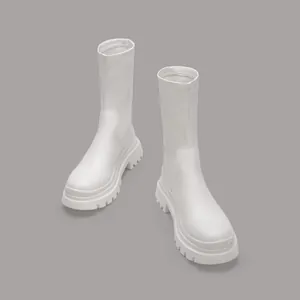 Detailed view of white platform mid-calf stretch boots with chunky lug sole design.