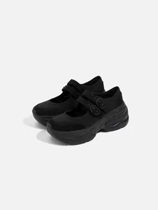 Detailed side view of elegant black platform Mary Jane shoes with stylish double buckles