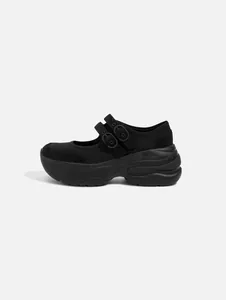 Side profile of a black platform Mary Jane shoe featuring chunky soles and double buckles.