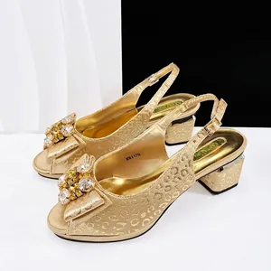 Gold leopard print women's pumps with sparkling rhinestone bow detail and slingback.