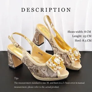Detail view of gold snake pattern high heels with large rhinestone buckle on square toe