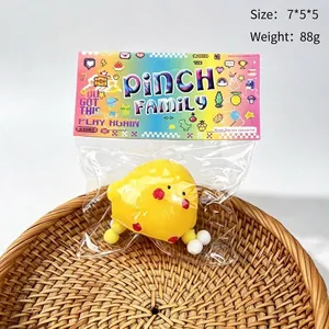 Detailed view of yellow chick squishy toy in packaging with size and weight info