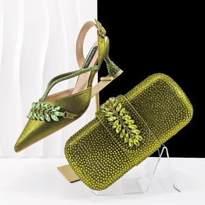 Detail of olive green pointed-toe rhinestone sandals and matching crystal evening bag set