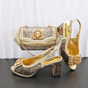 Detailed view of luxury gold snakeskin high heels and matching chain bag set with crystals