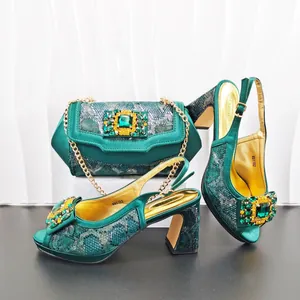 Elegant emerald green snakeskin rhinestone high heels and matching chain handbag set
