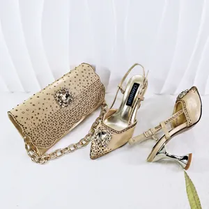 Elegant gold evening shoe and bag set with shimmering rhinestones and crystal flowers