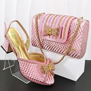 Pink snakeskin party shoes and matching square clutch bag set with rhinestone bow detail