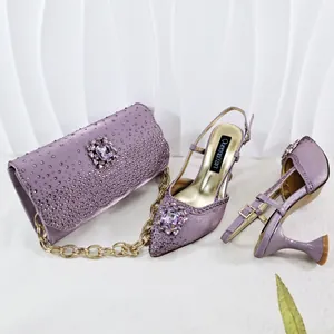 Detail view of purple rhinestone-encrusted evening shoe and matching clutch set