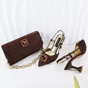 Close-up of brown rhinestone evening sandal and matching clutch set with gem details