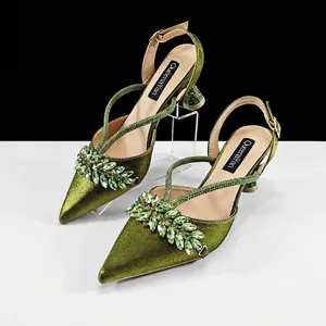 Elegant green satin pointed-toe slingback sandals with sparkling rhinestone embellishments