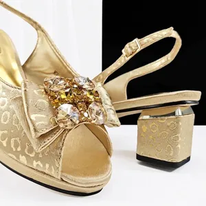 Elegant gold leopard print peep-toe heels with sparkling rhinestone bow decoration.