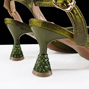 Close-up of olive green rhinestone heel on elegant pointed toe slingback sandals