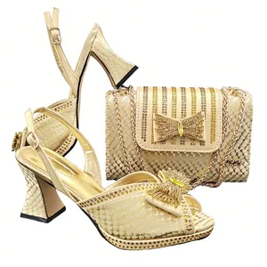 Gold snakeskin pattern block heel sandals with bow and matching evening clutch bag set