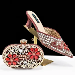 Burgundy rhinestone pointed toe mules and matching clutch bag set for wedding guest