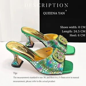 Detail of green square-toe sandals with colorful polka dots and shiny rhinestone buckles.