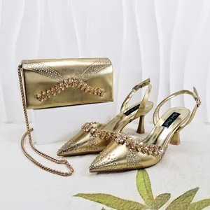 Elegant gold pointed-toe high heels and matching rhinestone clutch bag set for evening parties