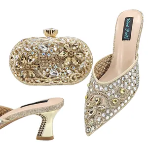 Elegant gold rhinestone pointed-toe mules and matching clutch bag set for weddings