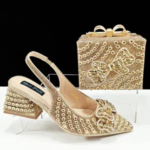 Elegant gold rhinestone slingback heels and matching butterfly clutch bag set for parties