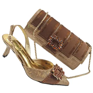 Elegant pointed toe heels and cylindrical evening bag set with rhinestone buckle