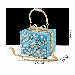 Blue rhinestone bow clutch bag with gold handle and chain strap, 12.5x10x10cm