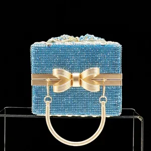 Elegant light blue rhinestone gift box clutch bag with gold bow clasp and chain handle