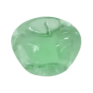 Macro view of a translucent green apple-shaped squishy toy designed for stress relief