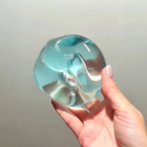 Clear blue apple-shaped squishy toy for stress relief and sensory play