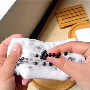 Jouet anti-stress DIY blanc pour presser les boutons avec des perles noires intégrées