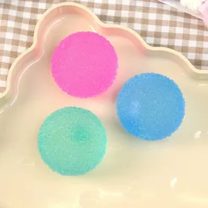 Three colorful textured squishy stress relief balls arranged in a cute cream tray